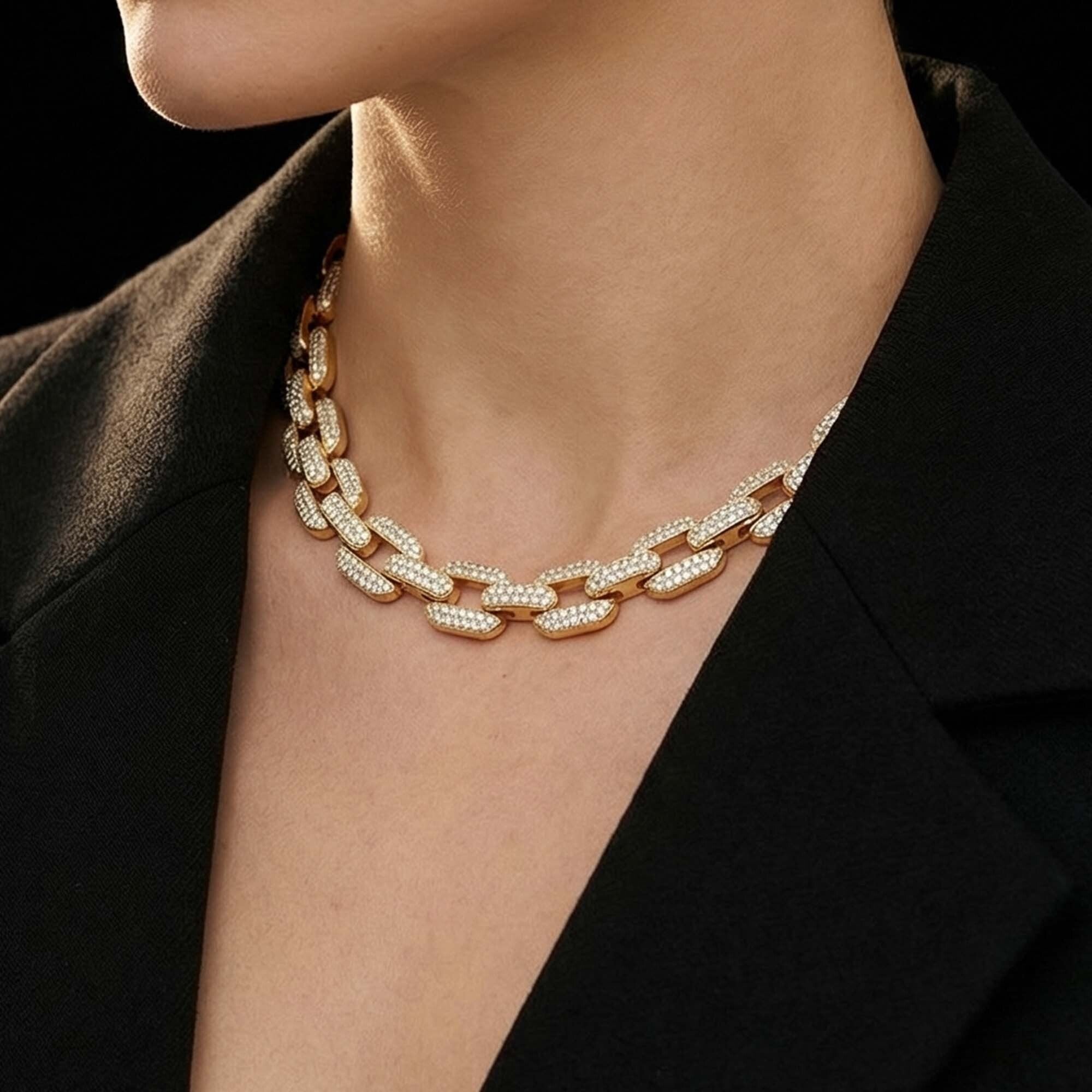 Gold chain necklaces for women with diamonds on a black background