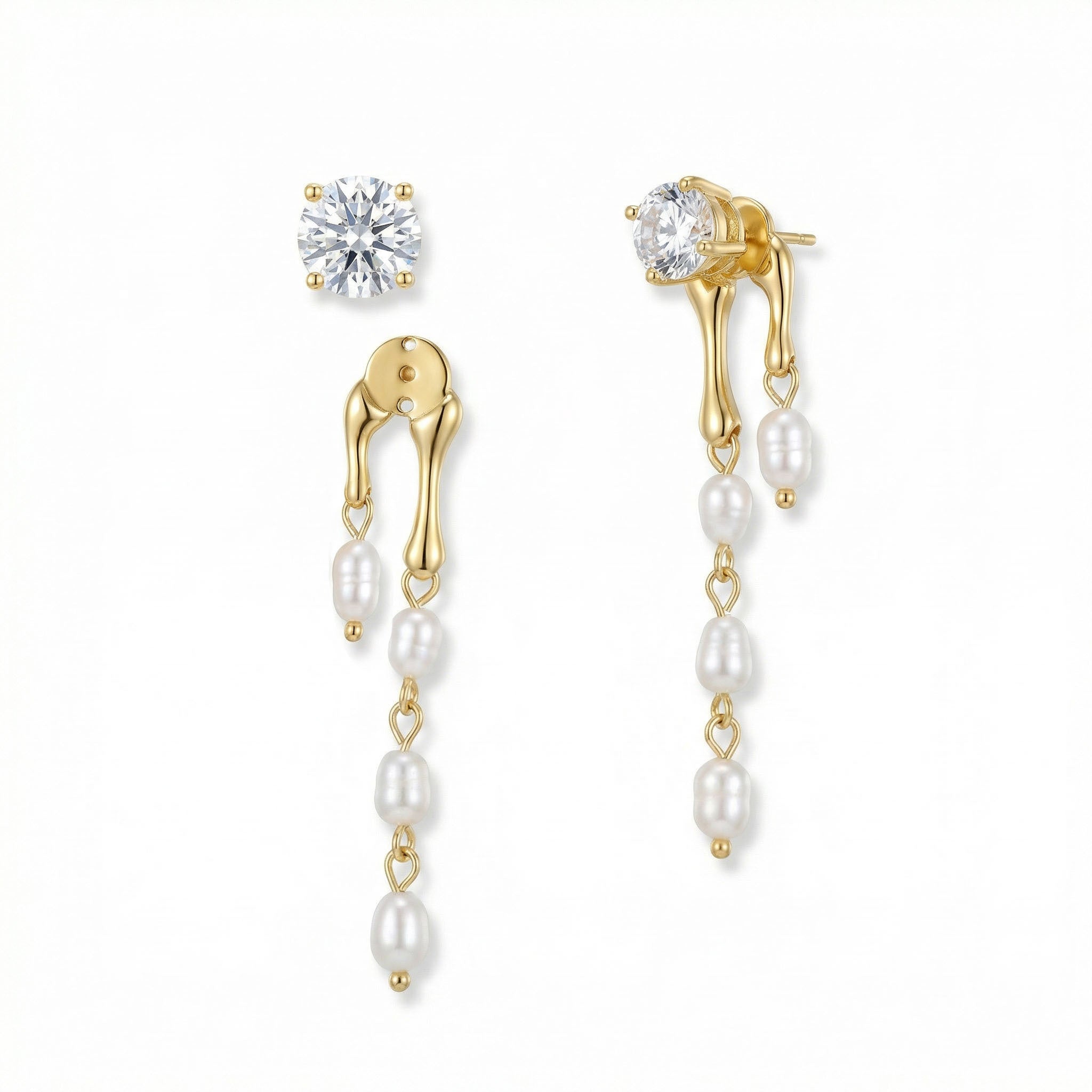 Gold earrings for women with pearls and clear gemstones on a white background