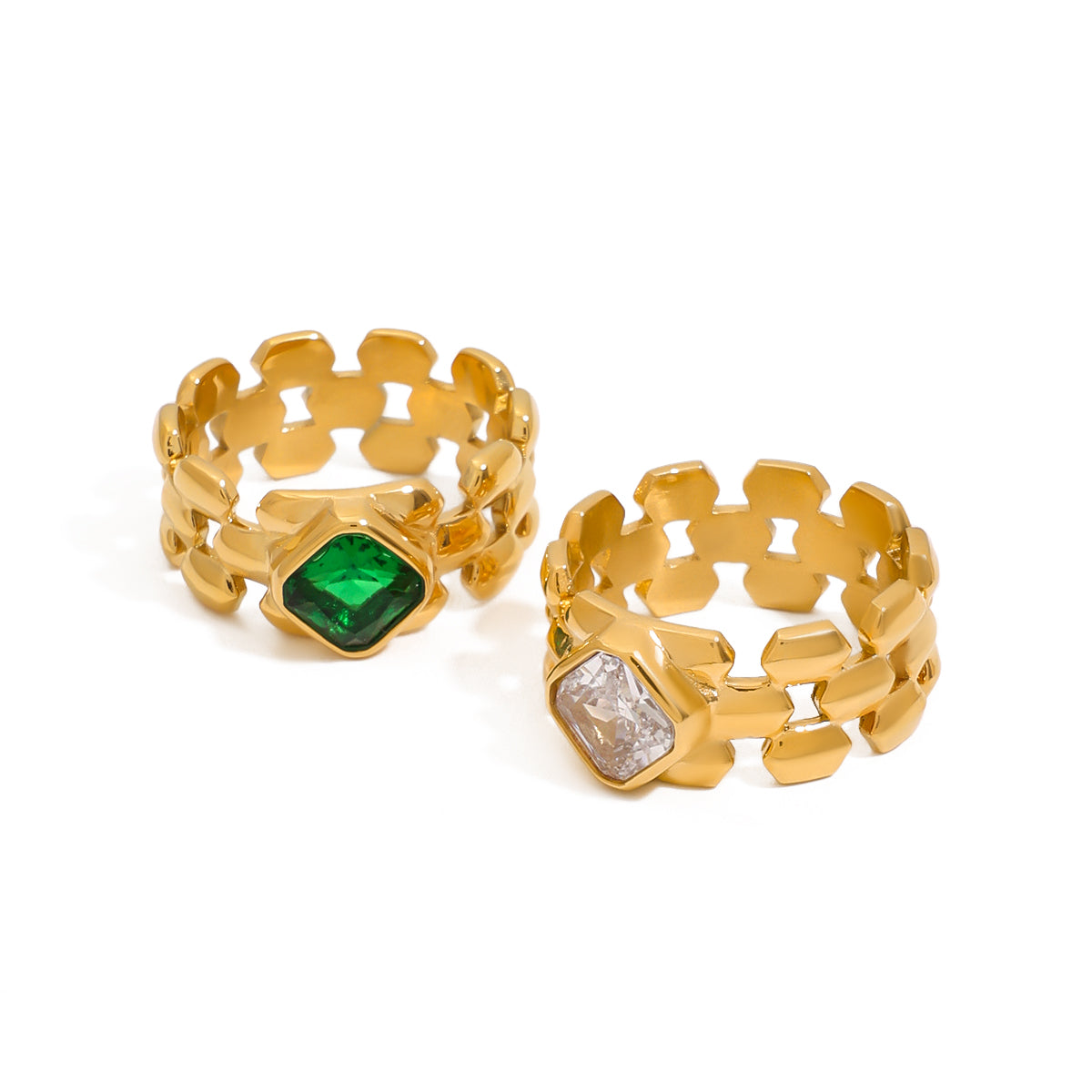 Two gold rings with gemstones]