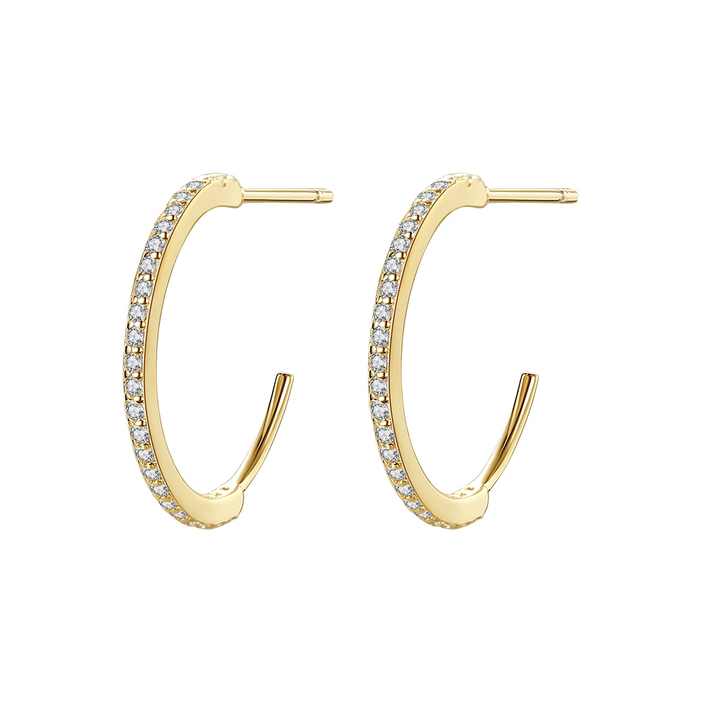 Gold hoop earrings for women with embedded stones on a white background