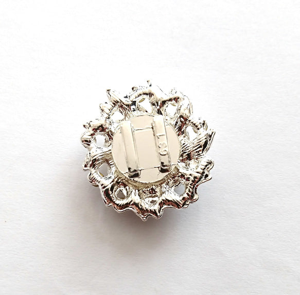  flower button intricate design on a white background