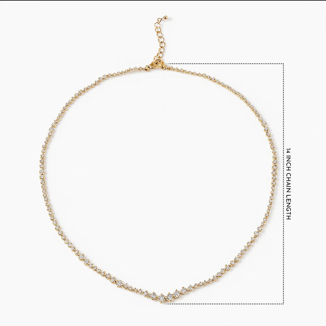 Gold necklace on a white background with chain length measurement.