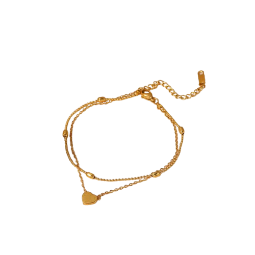 Gold anklet with heart charm on a white background