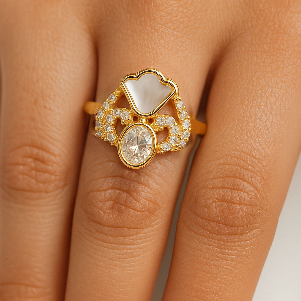 Gold ring with a diamond on a person's finger