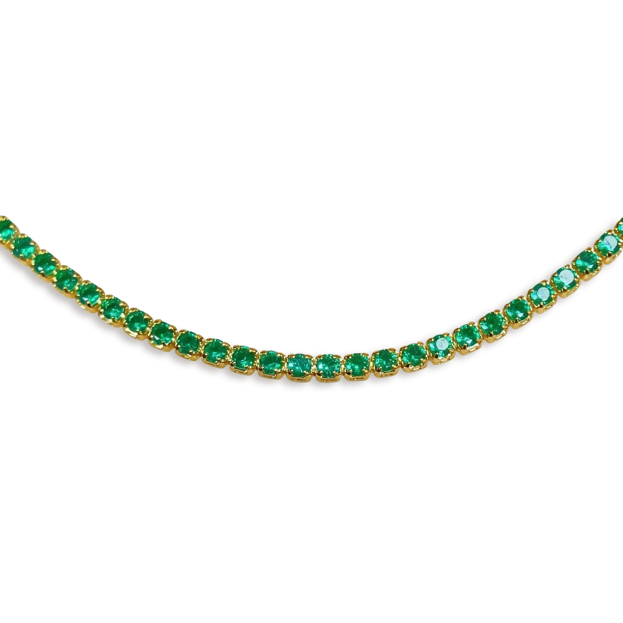 Gold necklace with green gemstones on a white background