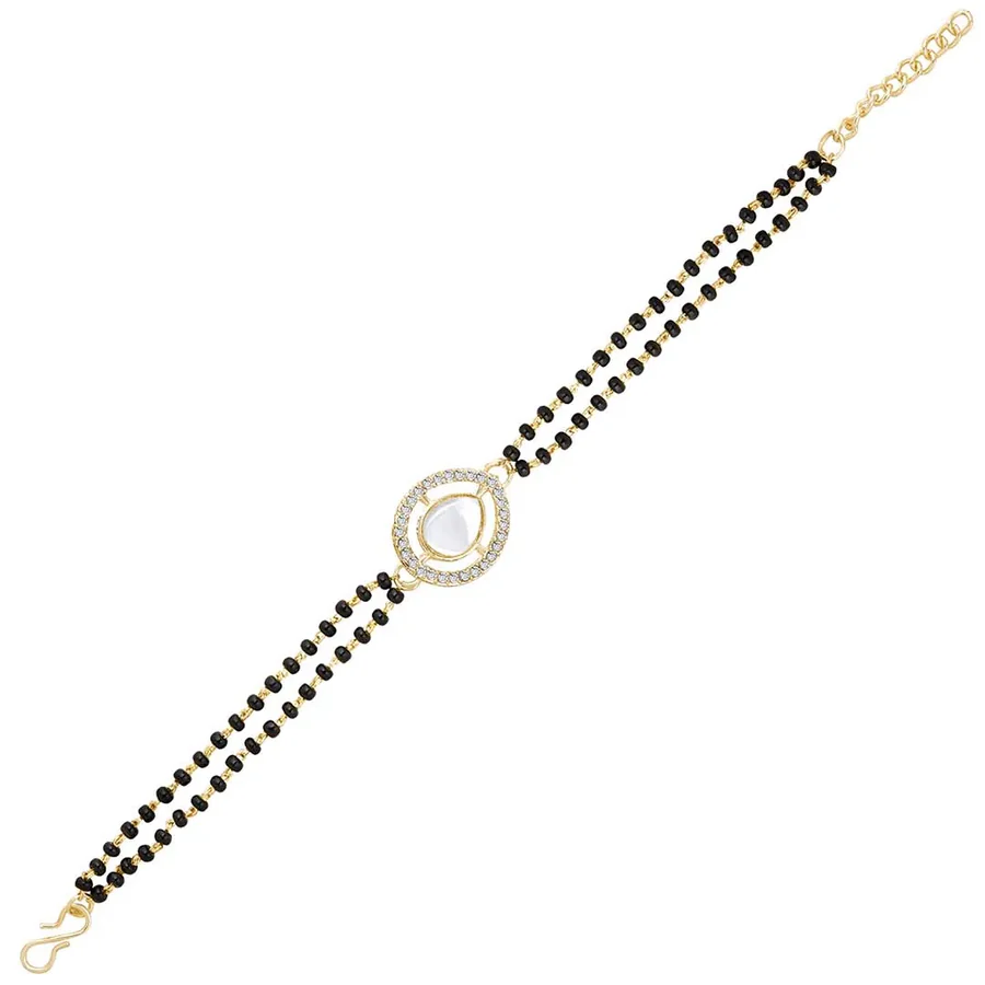 Black beaded bracelet with a gold clasp on a white background
