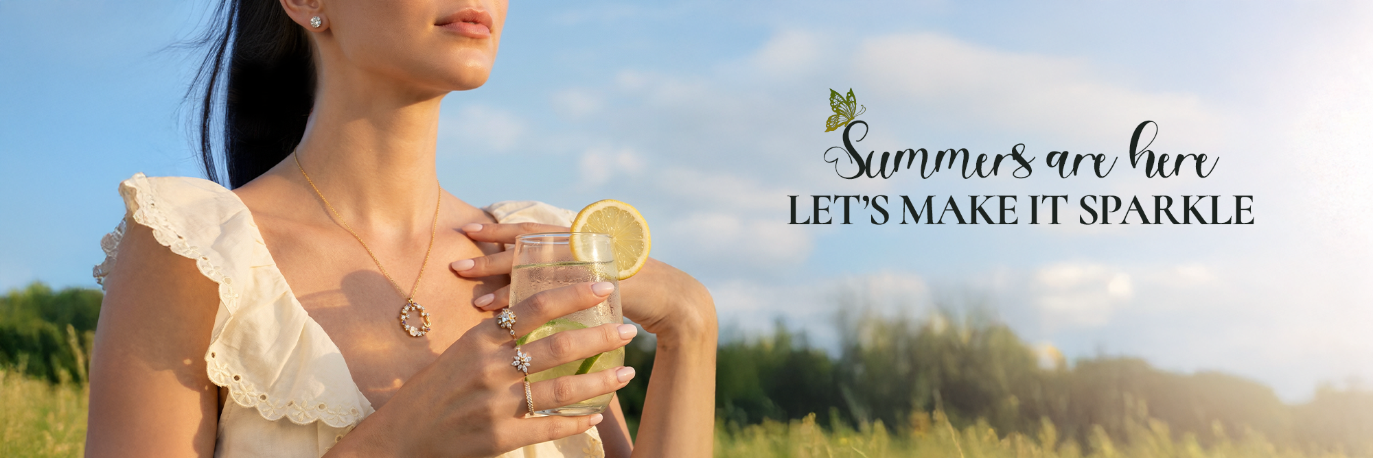 Woman holding a glass of lemonade with text 'Summers are here, let's make it sparkle' in a scenic outdoor setting.