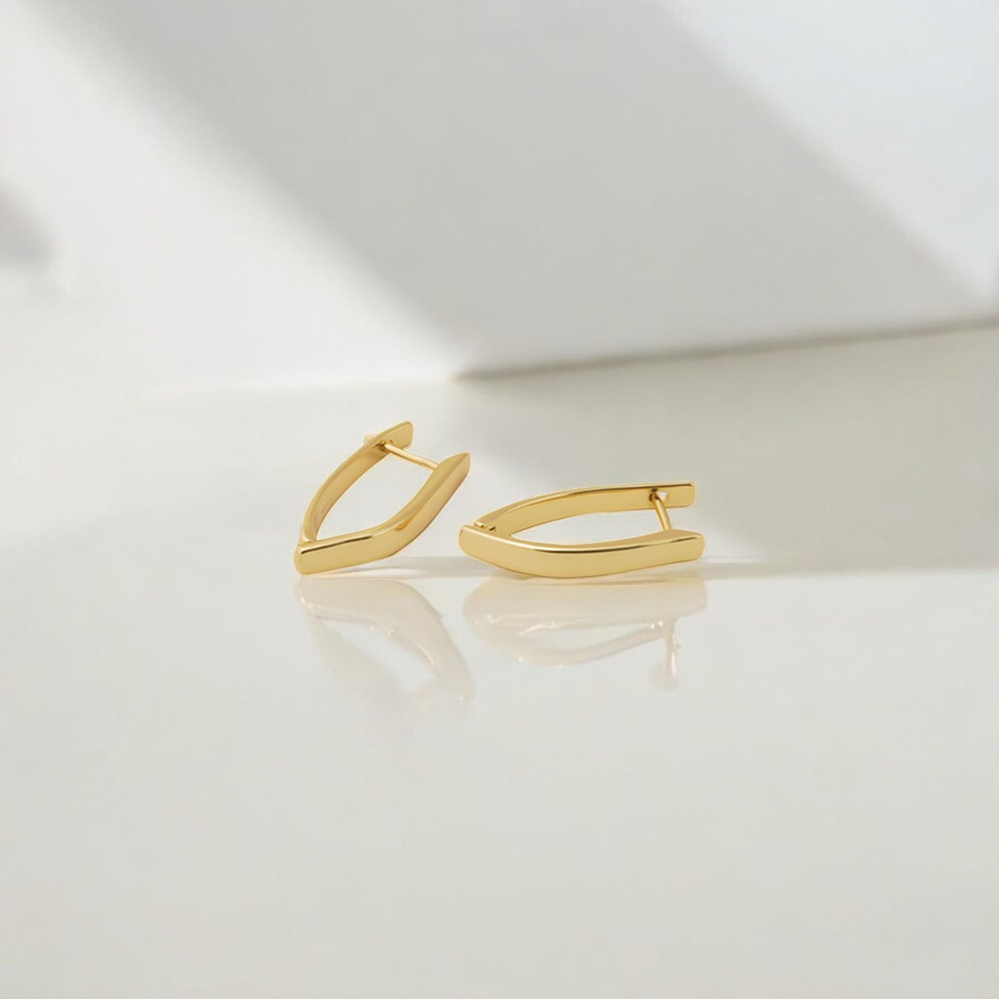 Sleek Twist Huggie Earring