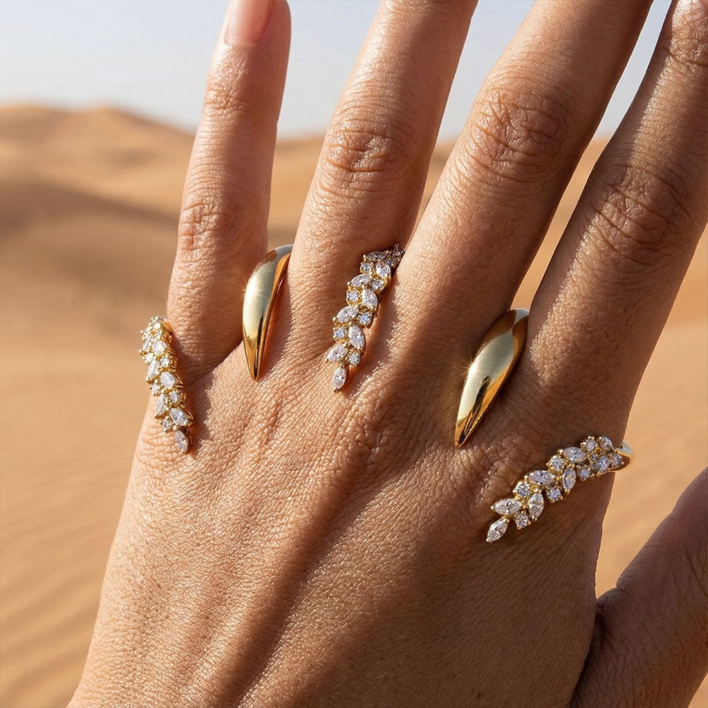 Hand wearing  Knuckle Ring with a desert background