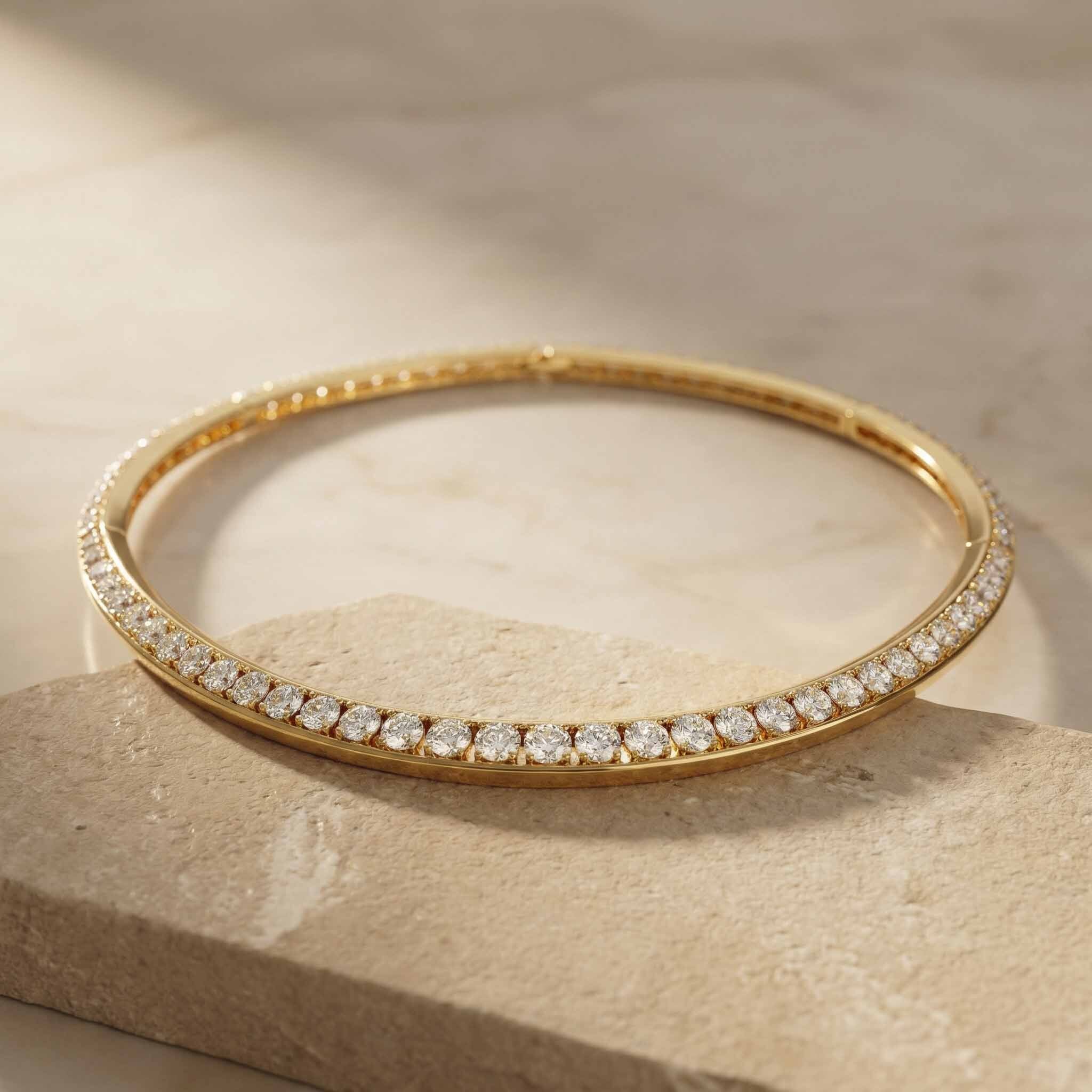 Gold necklace with diamonds on a beige stone surface